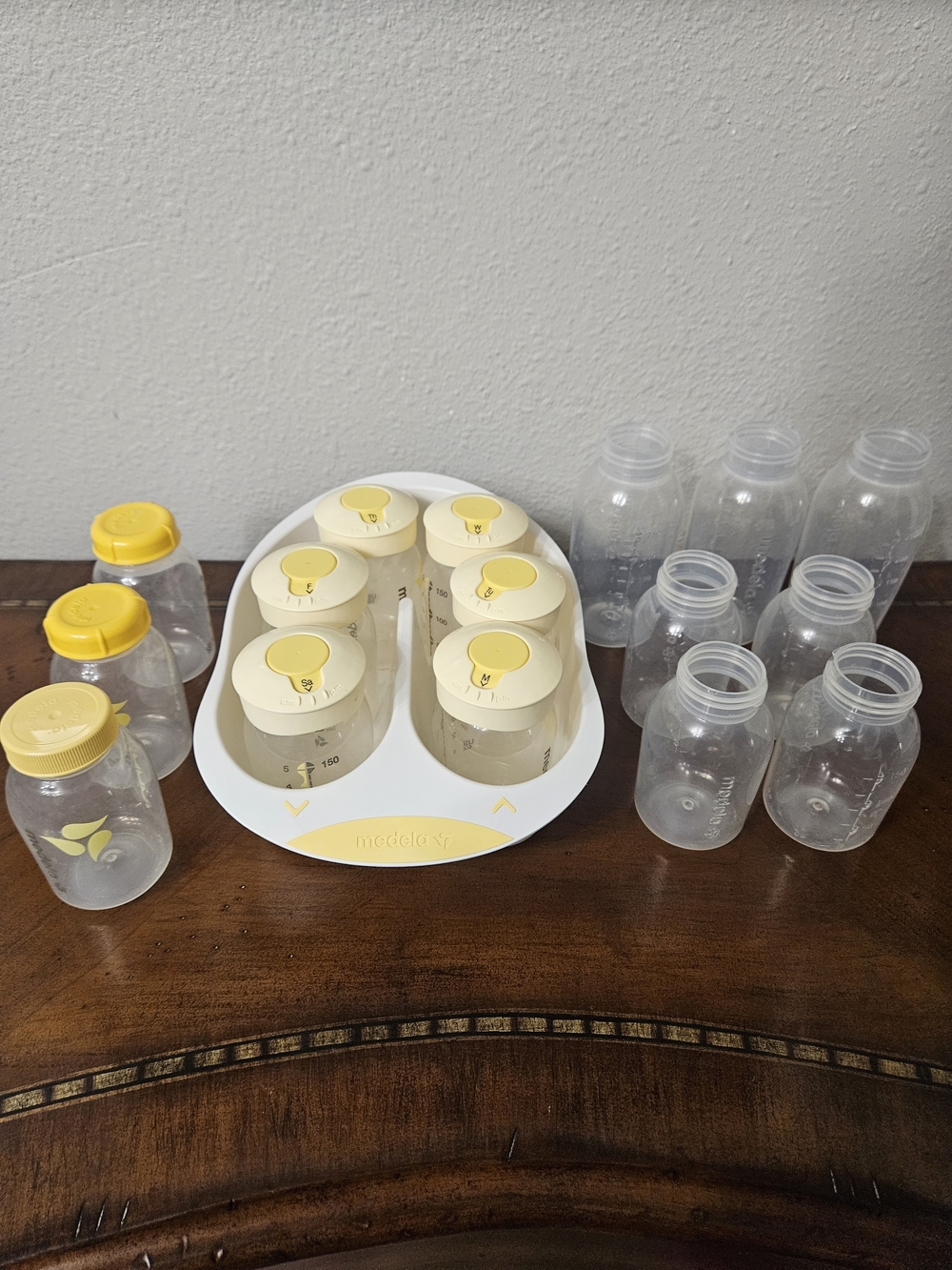 Medela Clear Pump Bottles with Yellow Lids and White Storage Tray